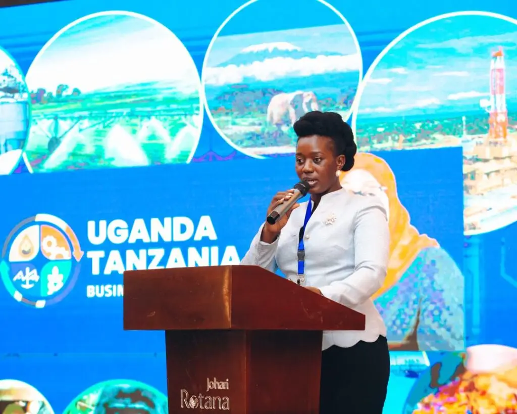 Mildred Tuhaise speaks at the 2024 Uganda Tanzania Business Forum